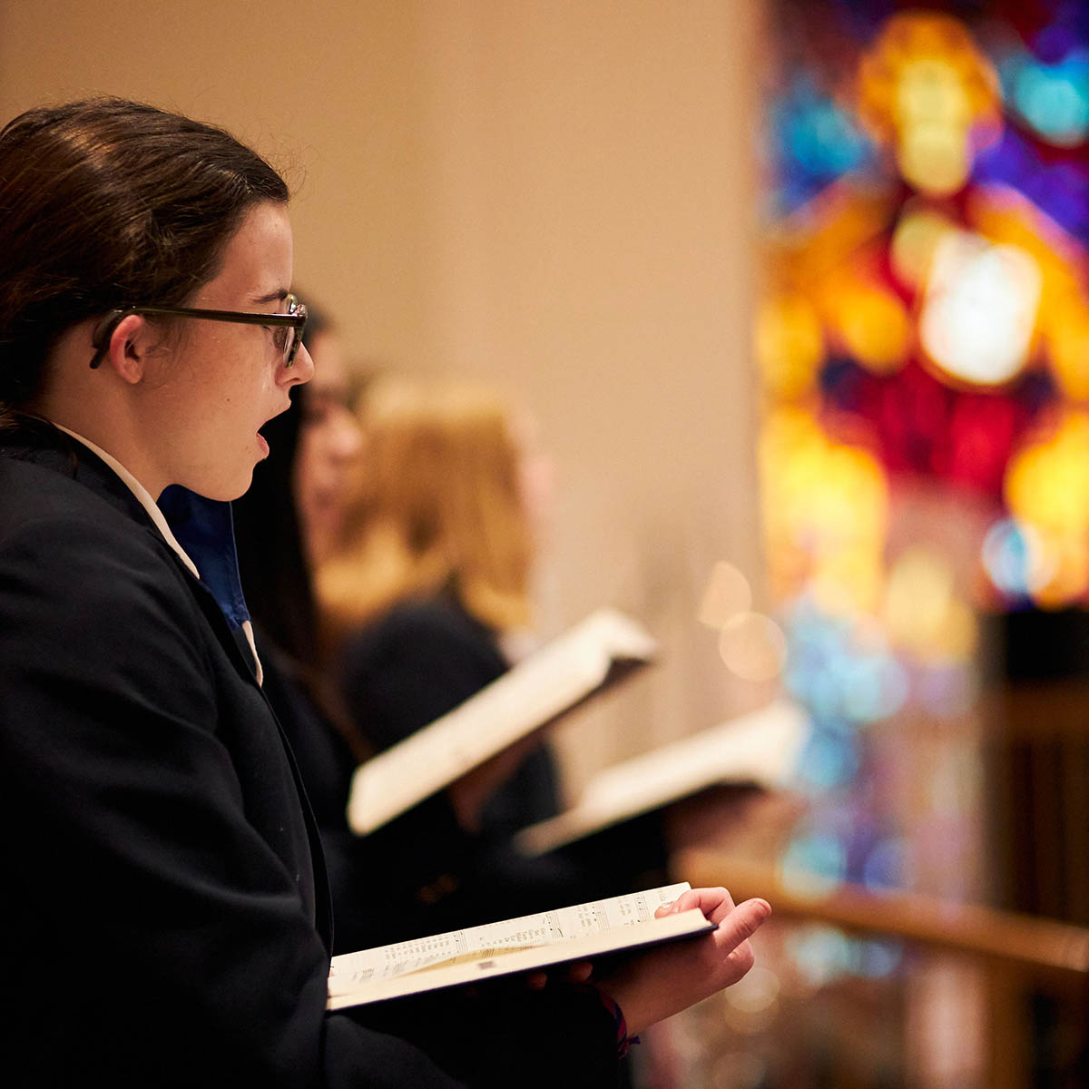 student singing in mass